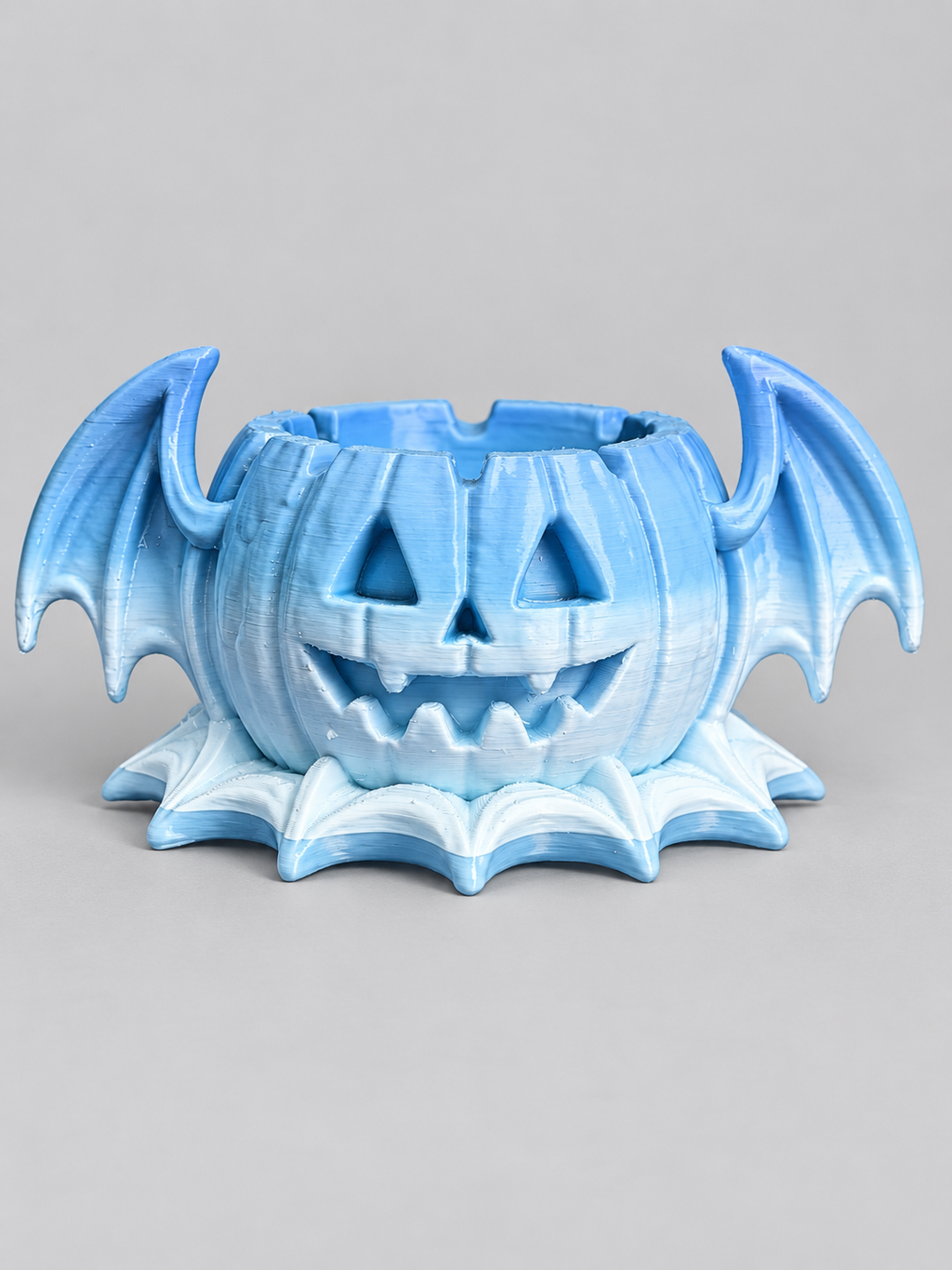 Finished pale blue bat-wing jack-o'-lantern ashtray made from resin mold