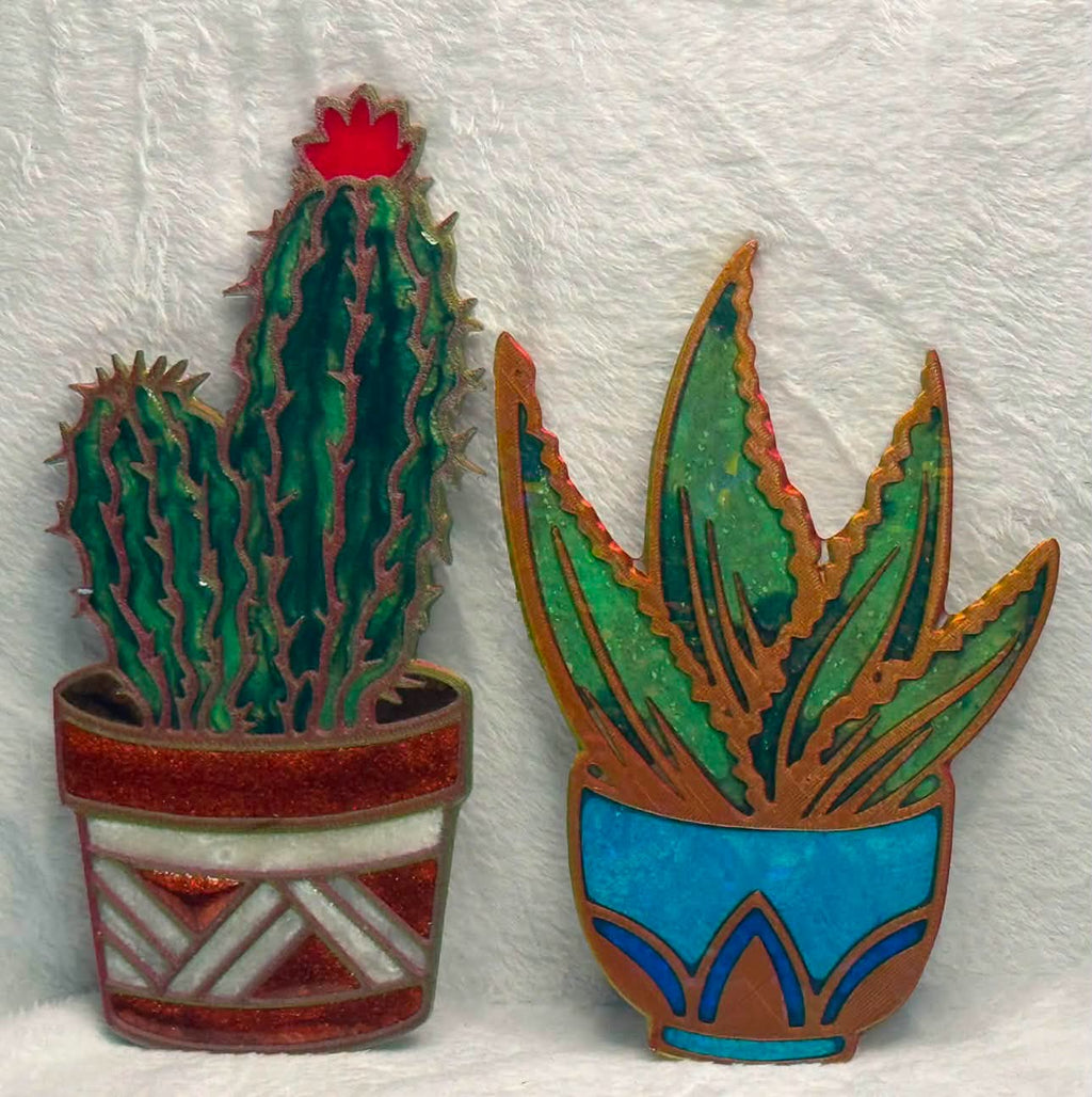 Example resin finish using cactus templates: green cactus and succulent in colorful decorative pots.