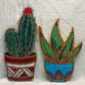 Example resin finish using cactus templates: green cactus and succulent in colorful decorative pots.