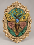 Finished example of celestial death moth with skull, moons, stars and ornate oval frame