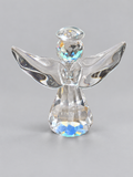Finished clear faceted glass-like angel made from a resin mold