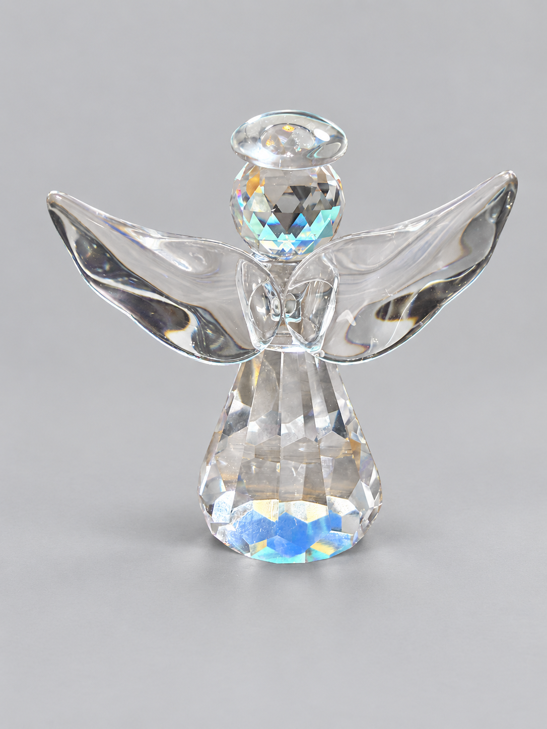 Finished clear faceted glass-like angel made from a resin mold