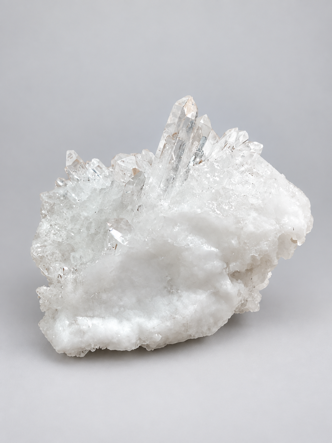 Finished clear and white natural crystal cluster made from a resin mold