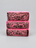 Finished stack of Spells Potions and Curses books made from a resin mold