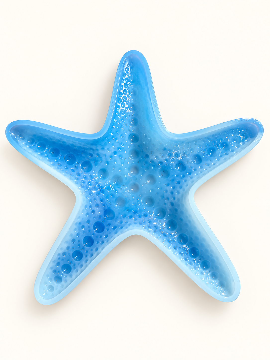 Blue textured starfish mold on a clean neutral background